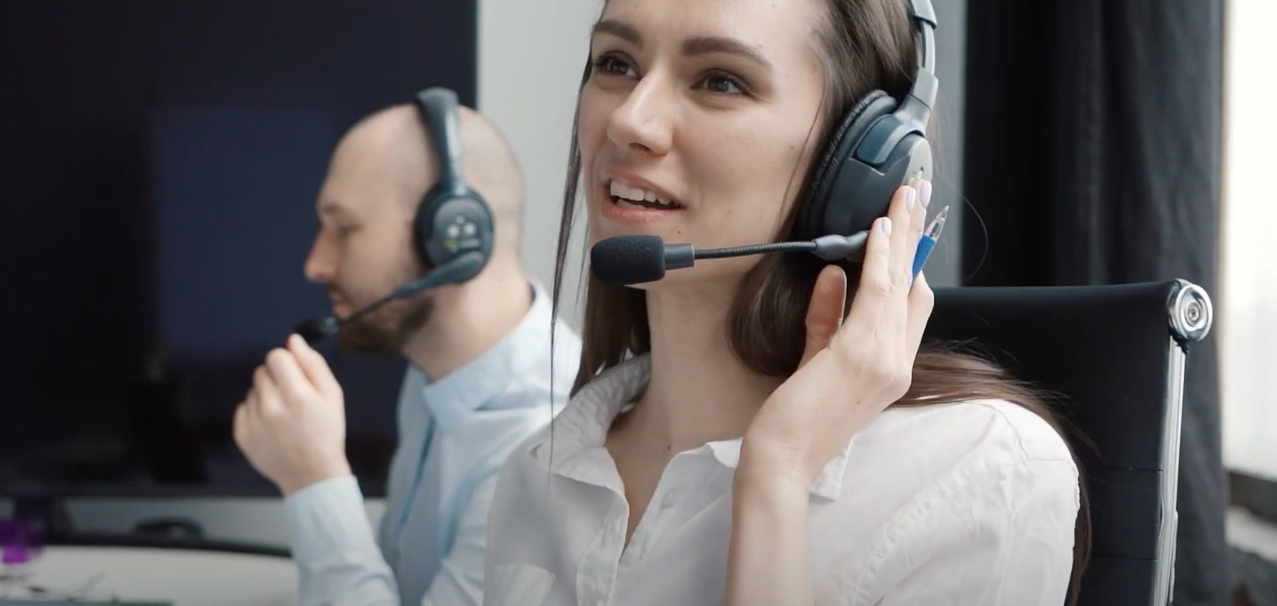 Customer Service Woman Talking to a Customer on a Headset